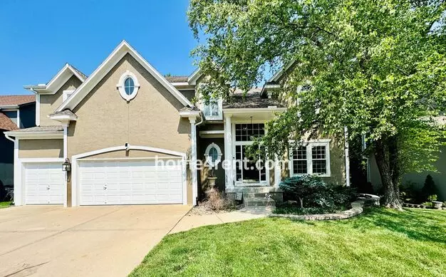 Beautiful Four Bedroom Home In A Quiet Neighborhood W/ An Updated Kitchen, Wood Floors, And A Finished Basement! Apartment for rent in Olathe, KS
