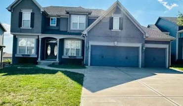 2 of 44 {20067} Custom Built Home In Woodland Manor + Open Main Level With Modern Lighting And Hardwood Flooring + Finished Walk Out Basement + Enclosed Sunroom + Three Car Garage + Fenced Yard House for rent in Olathe, KS