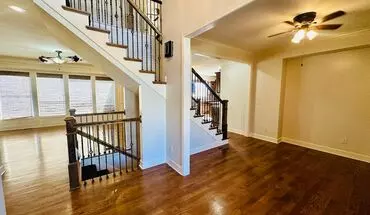3 of 44 {20067} Custom Built Home In Woodland Manor + Open Main Level With Modern Lighting And Hardwood Flooring + Finished Walk Out Basement + Enclosed Sunroom + Three Car Garage + Fenced Yard House for rent in Olathe, KS