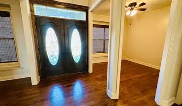 5 of 44 {20067} Custom Built Home In Woodland Manor + Open Main Level With Modern Lighting And Hardwood Flooring + Finished Walk Out Basement + Enclosed Sunroom + Three Car Garage + Fenced Yard House for rent in Olathe, KS
