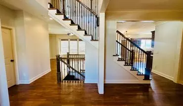 4 of 44 {20067} Custom Built Home In Woodland Manor + Open Main Level With Modern Lighting And Hardwood Flooring + Finished Walk Out Basement + Enclosed Sunroom + Three Car Garage + Fenced Yard House for rent in Olathe, KS