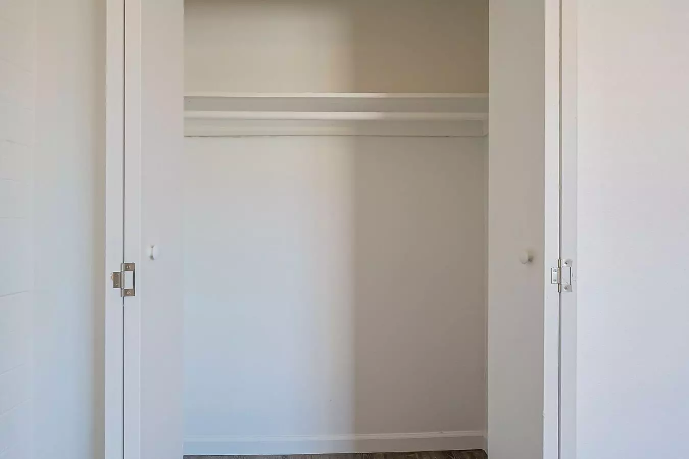 Closet storage — representative home at Rovey Apartments.