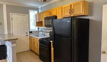 4 of 11 Spacious Home For Rent! Open Floor-plan! Partially Finished Basement! Front Porch & Fenced In Yard! Available Now! House for rent in Baltimore, MD